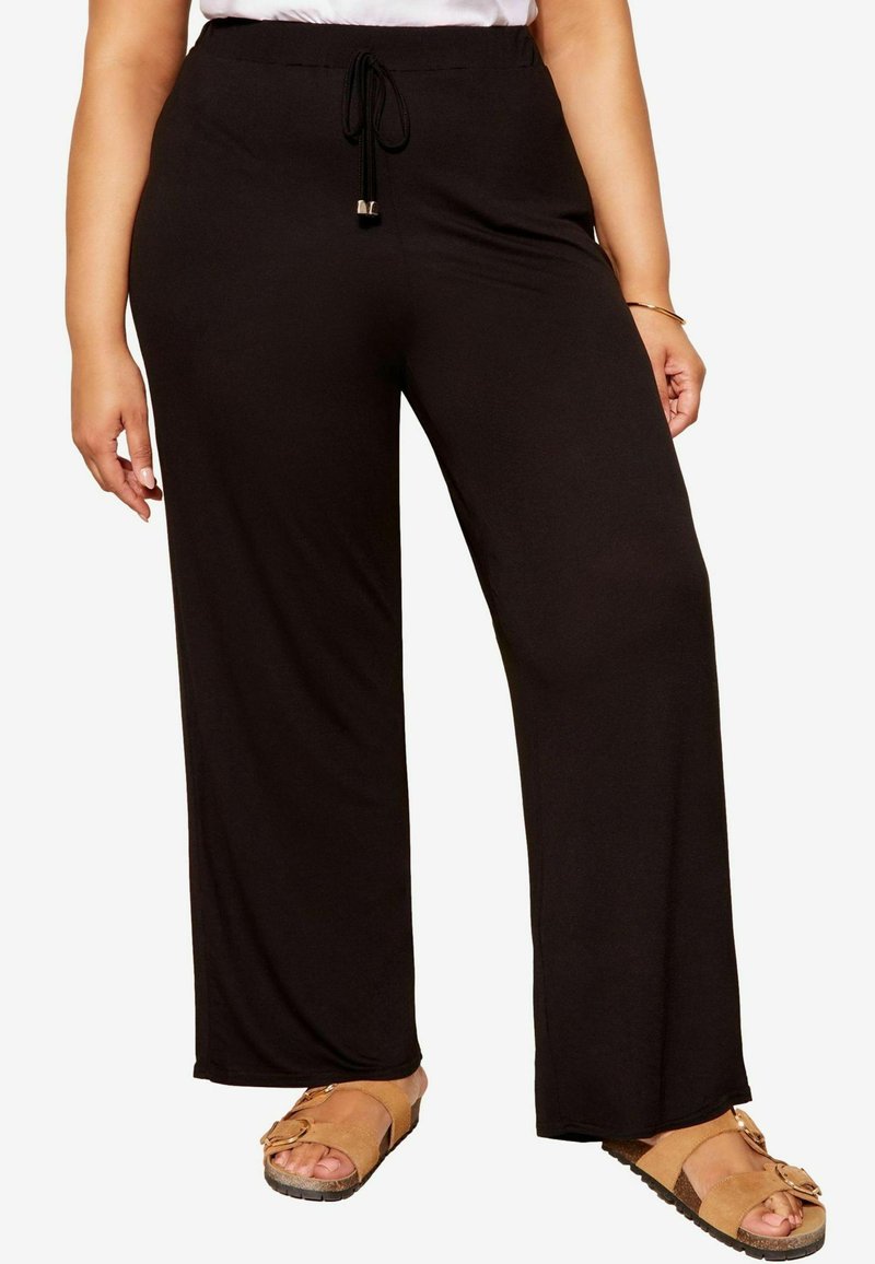 Pantalones de pierna ancha negros con cintura elástica y cordón ajustable. Material ligero, textura suave y sin patrones visibles.