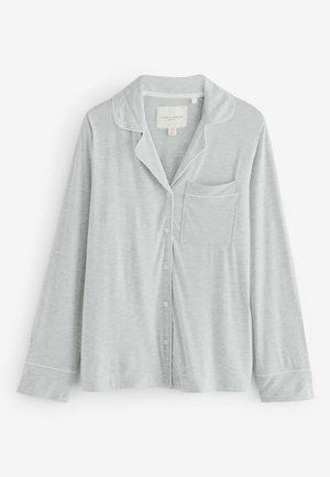 Gaiši pelēks pidžamas tops, kas izgatavots no maiga auduma, ar izgrieztu apkakli, priekšējo kabatu un pogu aizdari, kā arī balto apmalītes malu.