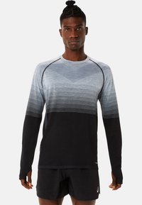 Langarm sportshirt met een gradientontwerp, dat van lichtgrijs naar zwart vervaagt; gemaakt van een gestructureerde stof met duimgaten.