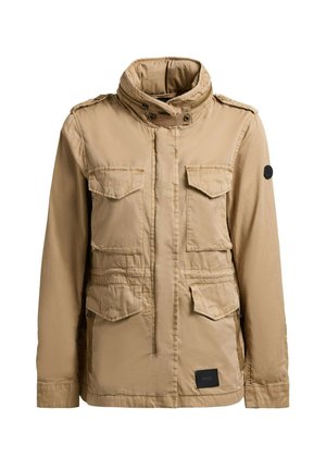 Heledatpruun tööjakk kõrge kraega, nelja eest kaetud taskuga, tõmbluku ja nööpkinnitusega ning musta logomärgiga alumisel ees.