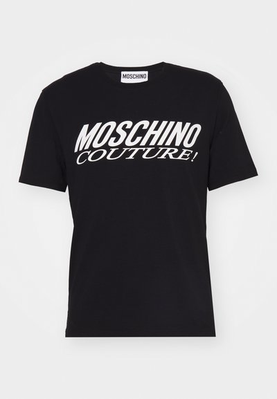 T-shirt in cotone nero con maniche corte e scollatura rotonda. Presenta il testo audace bianco "MOSCHINO COUTURE!" sulla parte anteriore.