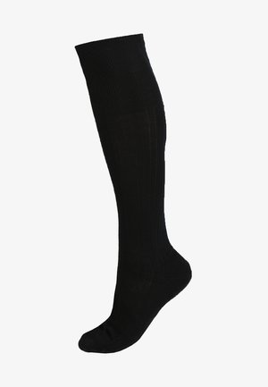 Knielange schwarze Socken aus geripptem Stoff, mit glatter Textur und passgenauer Form, die sich an das Bein anpasst.