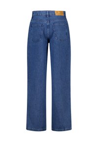 Blue denim jeans with a high waist, wide-leg cut, and a textured striped pattern. Back features two patch pockets and a leather label.