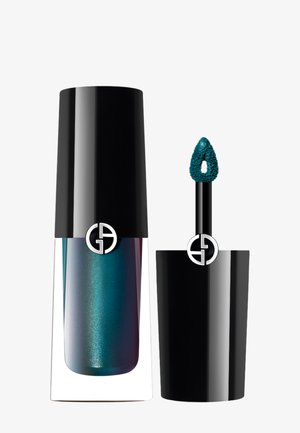 Couleur à lèvres liquide irisée teal dans un contenant transparent avec un capuchon noir, accompagnée d'un applicateur effilé et d'un détail de logo.