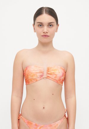 Strapless bikini top in soft, floral-patterned fabric featuring shades of pink and orange, with ruching details and a central gold clasp.