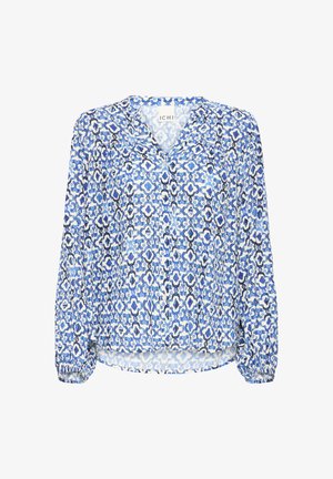Langærmet bluse med knapper foran, elastiske manchetter og et geometrisk mønster af blomster i blå, hvid og sort.
