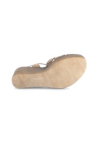 Beige sandal with a textured rubber sole, featuring a wavy pattern and "Gabor" branding. Upper has two flat straps for secure fit.