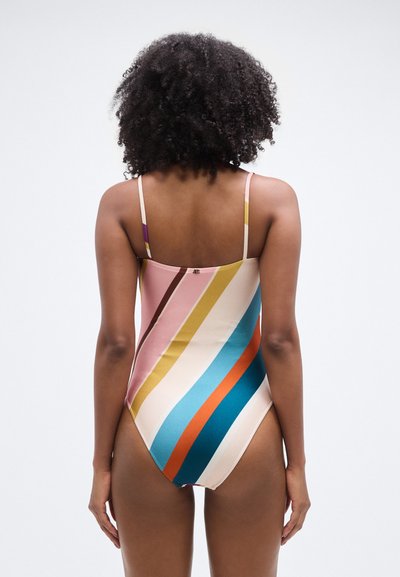 Ολόσωμο μαγιό με λεπτά τιράντες, με έντονες οριζόντιες ρίγες σε ροζ, κίτρινο, μπλε και πορτοκαλί σε κρεμ φόντο. Λείο ύφασμα.