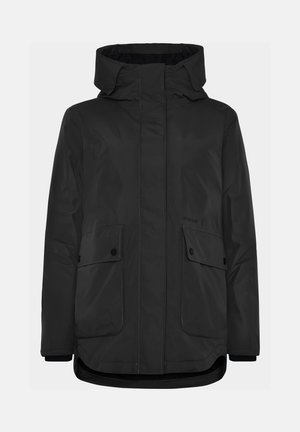 Veste extérieure noire avec fermeture éclair à l'avant, grandes poches à rabat, col haut et ourlet légèrement courbé. Fabriquée en matériau résistant à l'eau.