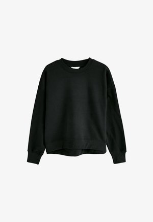 Svart sweatshirt med avslappnad passform, rund hals och sänkt axel. Har ribbade mudd och nederkant, tillverkad av ett mjukt, texturerat material.