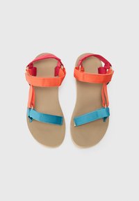 Colorful sandals featuring orange and pink straps with a textured tan sole and blue accent strap. Lightweight and adaptable design.