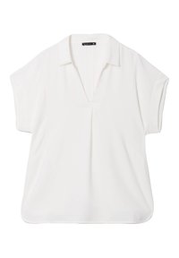 Blouse blanche à manches courtes avec un col en V, texture douce, coupe ample et poches latérales. Dotée d'un ourlet droit et d'un design minimaliste.