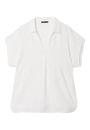 Weiße Bluse mit kurzen Ärmeln und V-Ausschnitt, weicher Textur, lockerer Passform und seitlichen Taschen. Mit geradem Saum und minimalistischem Design.