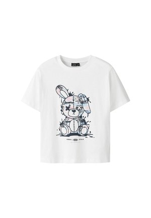 Camiseta blanca de algodón con un gráfico de un conejo de dibujos animados con detalles de costura y acentos de salpicaduras, cuello redondo y mangas cortas.