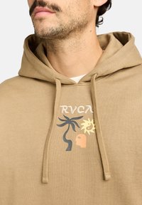 Brown hoodie featuring a graphic design with a palm tree, sun, and face in various colors. Made from soft fabric with a drawstring hood.