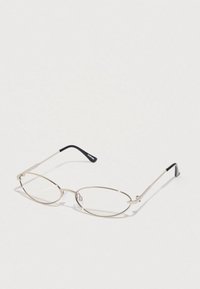 Ochelari metalici cu formă ovală, ramă subțire din argint și templieri cu accente negre. Lentile clare, design ușor și stil minimalist.