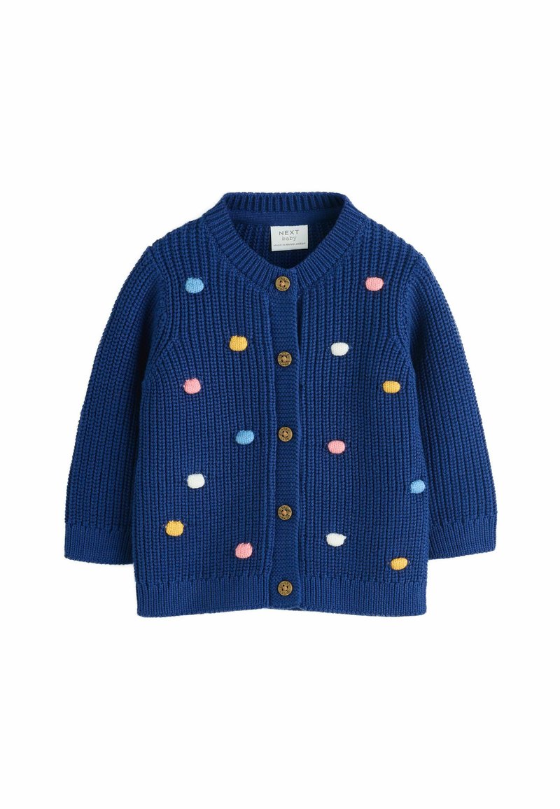 Mörkblå stickad babykofta med träknappar och flerfärgade pom-pom prickar utspridda på framsidan och ärmarna.
