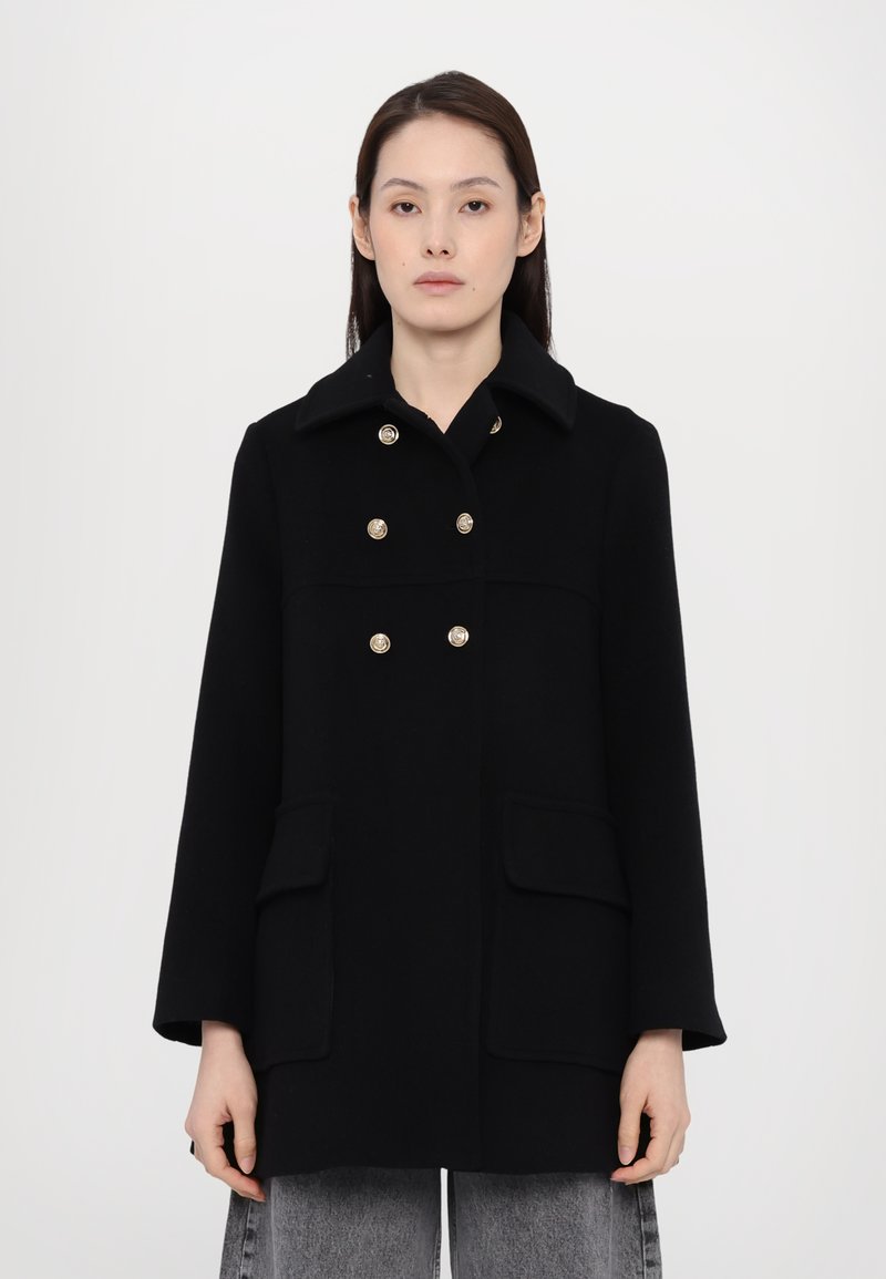Black wool coat with a collar, double-breasted design, gold-tone buttons, and two front pockets; features a straight cut and long sleeves.