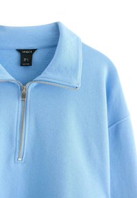 Lichtblauwe zip-up sweatshirt met een zilveren rits en een kraag, maat S, merk Lindex, gemaakt in Turkije.