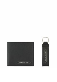 Black leather wallet with a textured finish and a silver "Armani Exchange" logo. Includes a matching keychain with a strap and logo.