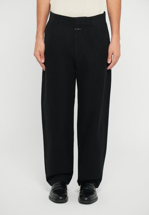 Black, wide-leg pants made of smooth fabric, featuring a flat front, belt loops, and a subtle logo at the waistband.