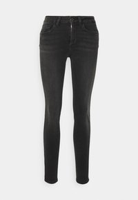Vaqueros skinny negros de denim con una textura suave, que cuentan con cremallera, cierre de botón, cinco bolsillos y detalles sutiles de desgaste.