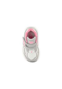 Children's sneaker in gray and pink, featuring a velcro strap, mesh material, rounded toe, and a cushioned interior.