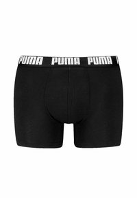 Boxer da uomo neri realizzati in tessuto morbido, con un ampio elastico in vita riportante il logo "PUMA" in bianco e una forma aderente.