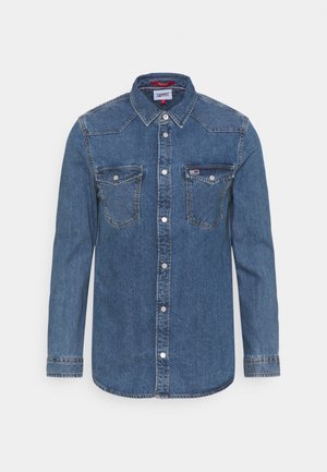 Denim-Langarmhemd mit Knopfleiste, zwei Brustklappentaschen, spitzem Kragen und Tommy Hilfiger-Logo auf der linken Tasche.