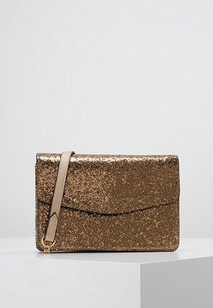 Rectangular gold glitter clutch purse with a beige wrist strap, displayed on a white pedestal against a light gray background.