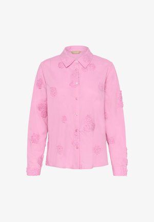 Roosa nööpidega särk, millel on lillemustriga tikandid, pikad varrukad ja klassikaline krae, valmistatud kergetest puuvillast kangast.