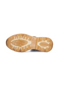 Brown rubber outsole with textured tread pattern, featuring a cream midsole and logo detail. Flat, rugged design for traction and durability.