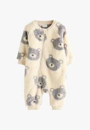 Fleece-Einteiler in Creme mit grauen Bärenmustern, Frontreißverschluss, gerippte Bündchen und runder Ausschnitt. Weiche Textur und lässige Passform.