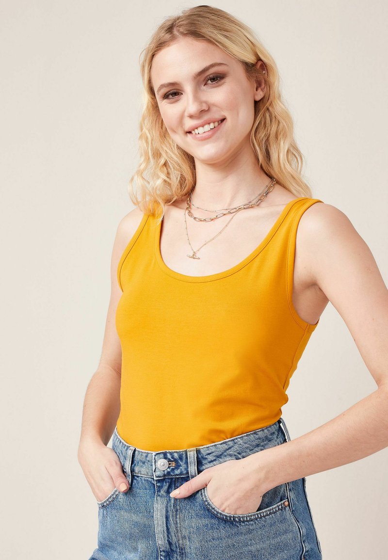 Next - THICK STRAP - Top - ochre yellow, Ingrandire