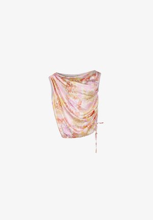 Haut à motifs floraux dans des teintes douces de rose et de jaune, avec un design drapé, un côté à nouer ajustable et une texture de tissu lisse.