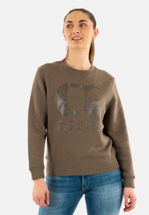 Sudadera marrón con un logo brillante en la parte delantera. Mangas largas, cuello redondo y puños y dobladillo de canalé con una textura suave.