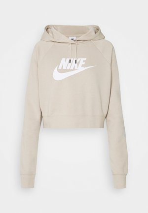 Sudadera corta beige con mangas largas, capucha con cordón y logotipo blanco de Nike centrado en el pecho.