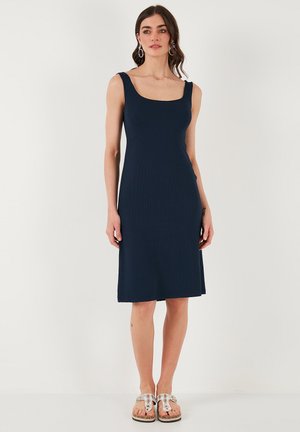 Navy blue sleeveless dress with a square neckline, made of ribbed fabric, fitting closely at the bodice and gently flaring at the hem.