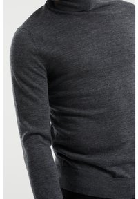 Dark gray turtleneck sweater made of a soft wool blend, featuring a close fit and ribbed cuffs and hem for texture and warmth.