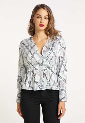 Weiße Bluse mit einem Kettenmuster in Schwarz, mit tiefem V-Ausschnitt, langen Ärmeln und einem Peplum-Taille-Design.