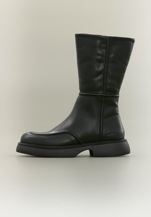 Black mid-calf leather boot with rounded toe, thick sole, and visible stitching, shown from the side on a neutral background.