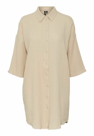 Beige knapp-up skjorta i texturerad tyg, med krage, breda korta ärmar och en något lös design med medellång skärning.
