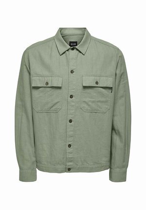 Hellgrünes, langärmliges Hemdjacke mit Knopfleiste, zwei Klappentaschen auf der Brust und spitzem Kragen.