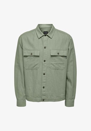 Hellgrünes, langärmliges Hemdjacke mit Knopfleiste, zwei Klappentaschen auf der Brust und spitzem Kragen.