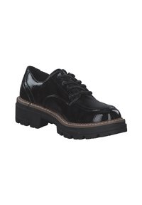 Scarpa di vernice nera con lacci, dotata di una suola in gomma nera spessa e testurizzata, e di un dettaglio a contrasto cucito sul bordo. Design con punta rotonda.