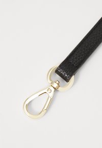 Black textured leather strap with a gold-tone metal clasp and circular connector. The strap features a subtle diamond pattern.