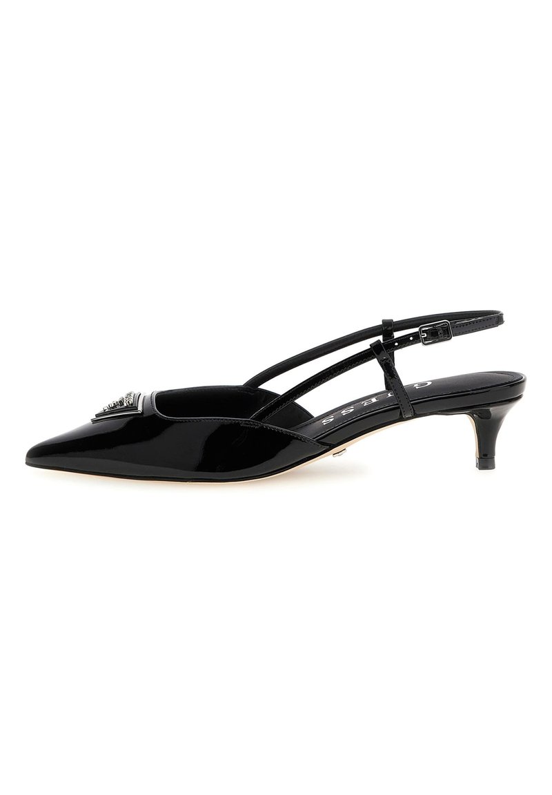 Black patent leather slingback heel, pointed toe, thin ankle strap with buckle, small heel, and decorative embellishment on vamp.
