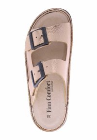 Koperkleurige slipper met twee verstelbare zwarte gespen, textuur bovenkant en een gevoerde binnenzool. Het label leest "Finn Comfort" en maat 38.