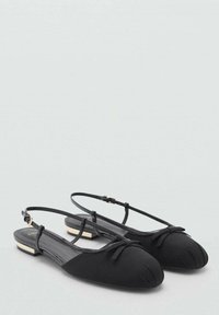 Black slingback flats with a rounded toe, bow detail on the front, and a low block heel; made of smooth fabric with a tonal finish.