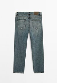 Denim jeans, straight cut, faded blue color, five pockets, belt loops, leather patch on waistband, raw hem at the bottom.